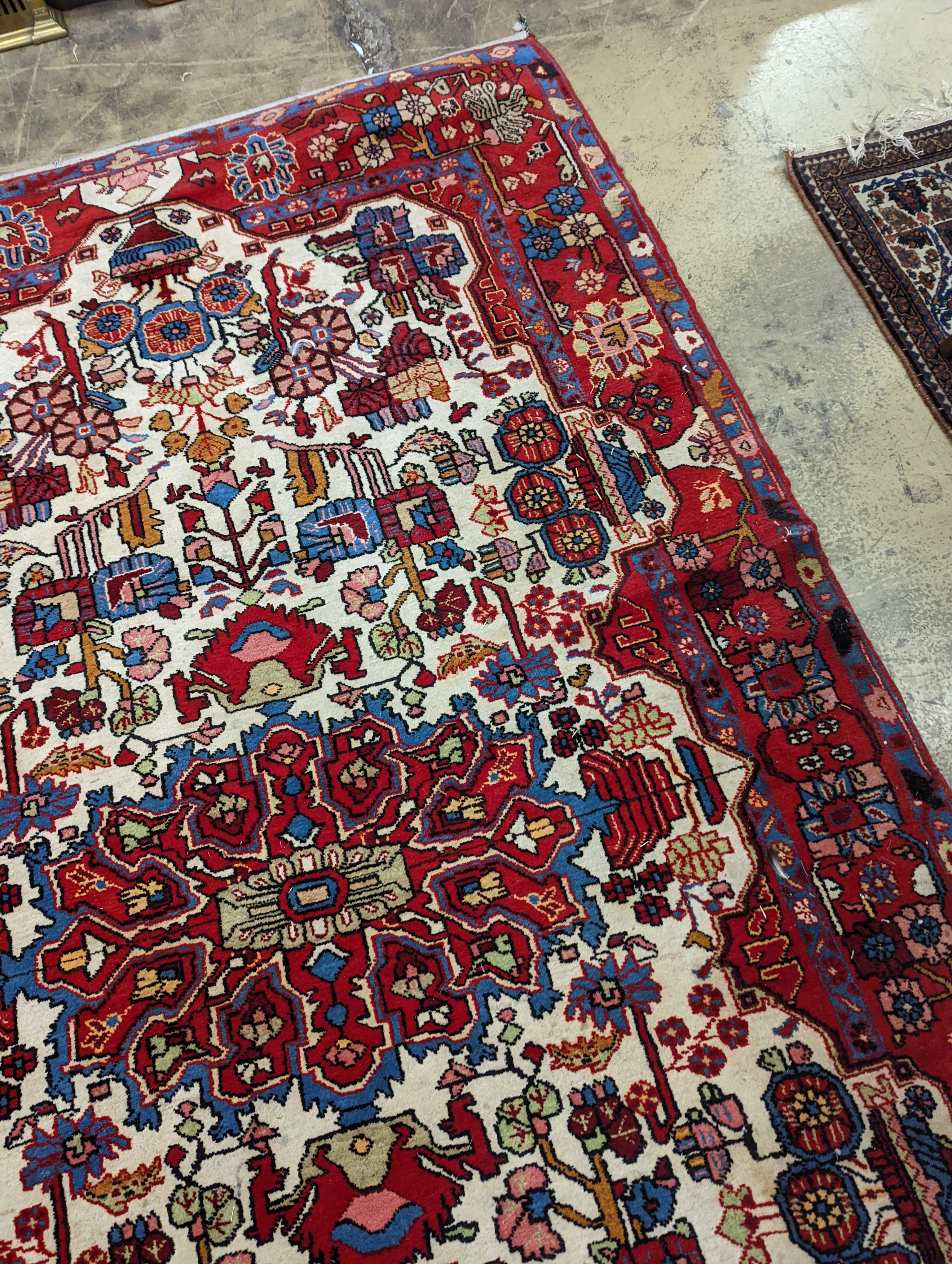 A Caucasian design ivory ground carpet, 260 x 158cm together with a smaller Tabriz style Tree of Life rug